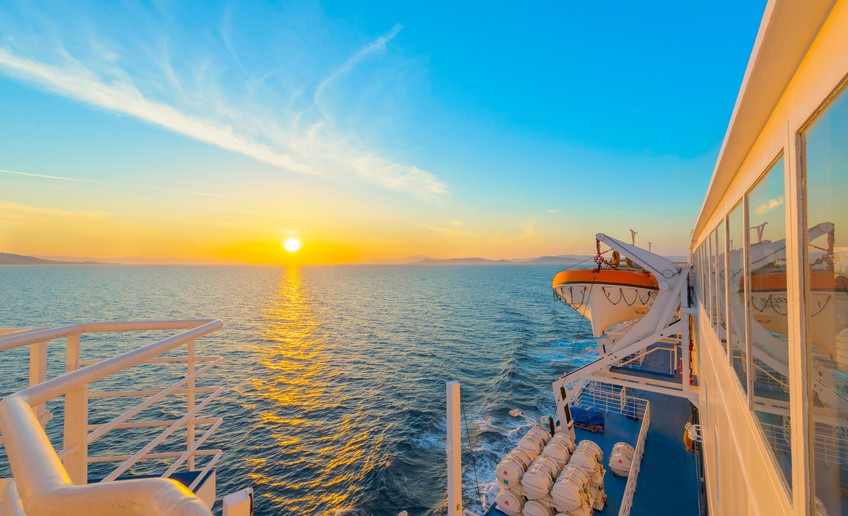 Sunset from ship at Mediterranean Sea during tour in Greece to Greek Islands